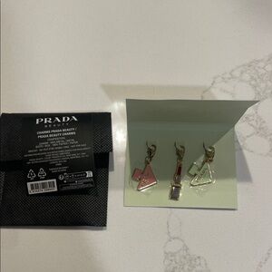 Prada Beauty Charms in Pink, Red, and Cream